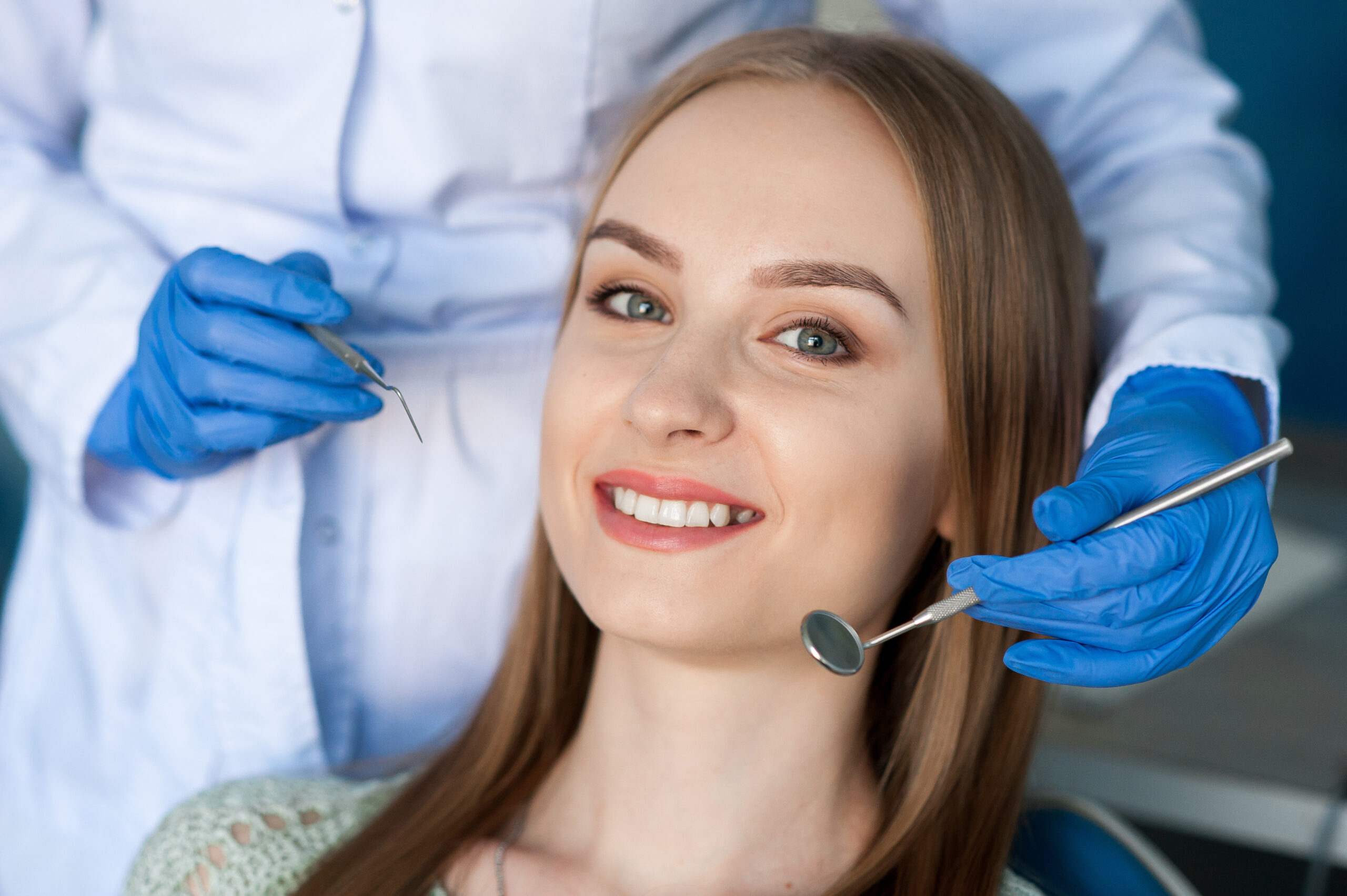 Dentist examining a patient's teeth